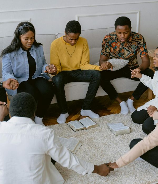 A diverse group of people sitting comfortably in a circle